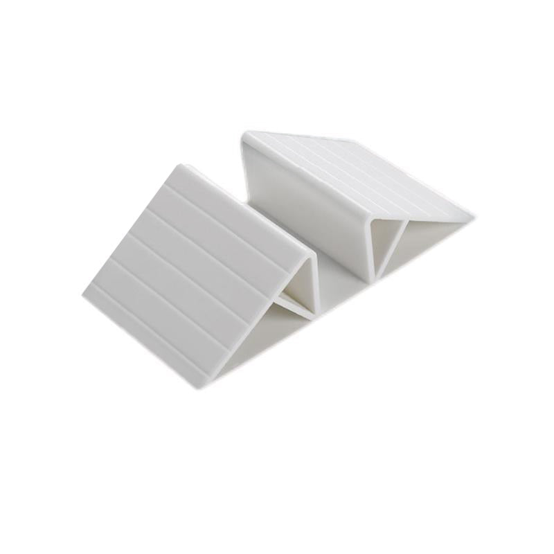 Tapis de renfort triangulaire entre les rallonges pour barrière de sécurité Monkey Mum®